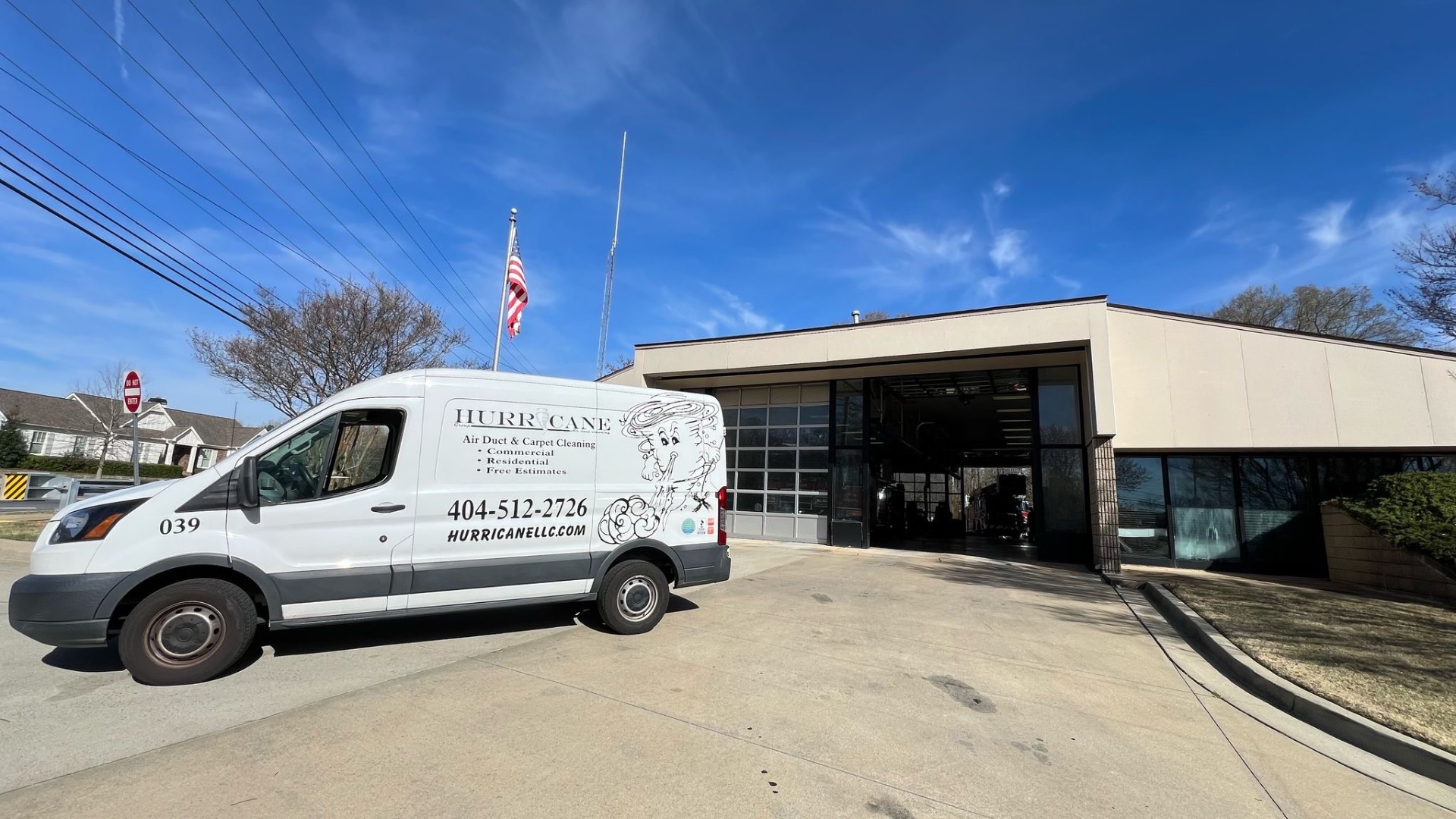 Fire station exterior — Hurricane Group van on-site at a Metro Atlanta fire-rescue facility for scheduled air duct service